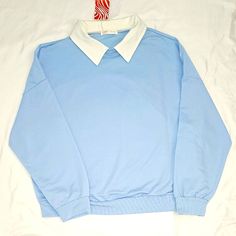 Light Blue Sweater With Collar. Drop Shoulder. Small. Sweater Is Very Lightweight 35% Cotton 65% Polyester. White Long Sleeve Top With Contrast Collar, Casual Blue Collared Top, Trendy Light Blue Sweatshirt For Spring, Casual White Sweatshirt For Work, Blue Collared Tops With Contrast Collar, Trendy Blue Collar Tops, Blue Tops With Contrast Collar For Work, Blue Workwear Tops With Contrast Collar, Light Blue Turtleneck