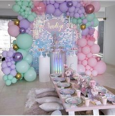 an instagram with balloons and confetti on the table for a birthday party