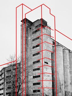 an old building with red lines in front of it