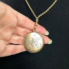 This gold-filled Victorian classic locket has a lovely engraved monogram (SJE?) on its exterior and an original photo shield and ring on its interior, ready for you to insert your own personal treasure. The 28" unique gold-filled chain is a perfect mate for the locket and includes an antique dog clip clasp so you could use the chain with any other pendant or locket in your collection! Bonus! (Note: this locket shows its Victorian roots with a few subtle dents; see pics.) Victorian Round Locket Necklace Stamped 14k, Antique Medallion Locket Necklace Stamped 14k, Engraved Rose Gold Heirloom Locket Necklace, Formal Rose Gold Engraved Locket Necklace, Classic 14k Stamped Medallion Locket Necklace, Vintage Etched Rose Gold Jewelry, Vintage Rose Gold Etched Jewelry, Classic Vintage Charm Locket Necklace Collectible, Classic Hallmarked Pendant Locket Necklace