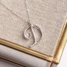 "D Initial Pendant Necklace / Dainty Silver Necklace / Custom Necklace / Name Silver Necklace / Personalized silver necklace / Letter D Dainty \"D\" initial. Perfect every day necklace. Lovely gift for your self, sister, bridesmaids, new mom. Convo me if you would like to customize the length of the chain. The possibilities are endless. Pendant: Base metal is brass and silver plated on top. Chain is 18 inches, sterling silver. (if you would like a longer or shorter chain, please contact us to cu Cursive Letters Fancy, Every Day Necklace, Dainty Silver Necklace, D Initial, Necklace Name, Stylish Letters, Letter Pendant Necklace, Initial Pendant Necklace, Letter D