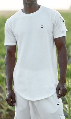 QL IGO Relaxed Cargo Shorts and T-Shirt Set in Cream Description: Picking summer outfits can be tough, QL IGO Relaxed Cargo Shorts and T-Shirt Set can become your best option for an effortless and stylish look. This fashion-forward set features a classic T-shirt designed with a pocket on the right shoulder that matches the cargo pockets on the cropped Sniper Cargo pants to give it a modern touch. These Relaxed Cargo Shorts and T-Shirt Sets also offer a new ultra soft fabric making it very comfor Summer Athleisure T-shirt With Short Sleeves, Summer Athleisure Short Sleeve T-shirt, Summer Short Sleeve Athleisure T-shirt, Moisture-wicking Cotton T-shirt For Summer, Modern Islamic Clothing, Shorts Cargo, Cargo Pants Outfit, Islamic Clothing, Pants Outfit