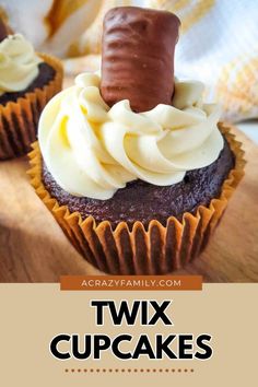 two chocolate cupcakes with white frosting on top and the words, twix cupcakes