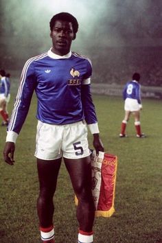 a man standing on top of a soccer field