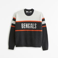 NFL Cincinnati Bengals sweater in our soft sweater-knit fabric and oversized-fit silhouette, featuring a slightly cropped body length, Cincinnati Bengals script graphic logo detail at chest, arm band details, crew neckline and banded hem and cuffs. Nfl Kansas City Chiefs, Men's Tops, Graphic Logo, Soft Sweater, Cincinnati Bengals, New York Jets, Kansas City Chiefs, Softest Sweater, Sweater Knit