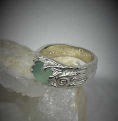 This ring comes out of the magic forest!  Its patterns and its stone give it a magical allure!  Sterling silver ring set with a stunning aqua chalcedony.  Original aquatic sculpture with a pretty spiral.  Inspired by stone, I sculpt the piece in wax and then cast it in sterling silver (lost wax technique.) Each ring is ergonomically made, comfortable. You will also appreciate the feel of a solid silver ring.  Calcedoine: 8 mm  If you want another size, stone, or another model, let me know and I Handmade Silver Rings With Ocean-inspired Style, Silver Ocean-inspired Jewelry For Promise Ring, Silver Ocean-inspired Promise Ring, Ethereal Sterling Silver Rings, Mystical Sterling Silver Cabochon Ring, Ethereal Sterling Silver Rings In Silver, Ethereal Sterling Silver Gemstone Rings, Green Ocean-inspired Sterling Silver Jewelry, Nature-inspired Sterling Silver Cabochon Ring