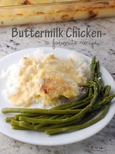 a white plate topped with green beans and mashed potatoes