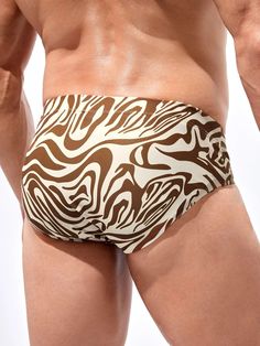 Embrace a wild and stylish swimwear statement with our Zebra Striped Print Swim Brief. The bold pattern features striking zebra stripes, creating a fierce and unique look. Made from a fabric with medium stretch, these briefs offer comfort and flexibility for your beach or poolside adventures. Get ready to make a bold splash with this eye-catching swimwear choice. Specification: Pattern Type: Zebra Stripe Type: Briefs Fabric: Medium Stretch Material: Fabric Composition: 82% Polyester, 18% Elastan Stretch Zebra Print Bottoms For Summer, Stretch Zebra Print Swimwear For Beach, Zebra Print Stretch Swimwear For Beach, Paisley Shorts, Swimming Shorts, Zebra Stripes, Swim Brief, Printed Swim, Mens Swim Trunks