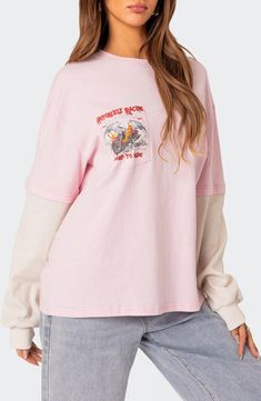 Fiery racing graphics blast across the front and back of this oversized cotton T-shirt flanked by waffle-knit long sleeves. Crewneck Long sleeves with ribbed cuffs 100% cotton Machine wash, dry flat Imported Oversized Pink Graphic Print T-shirt, Oversized Pink T-shirt For Streetwear, Oversized Pink Top With Crew Neck, Pink Long Sleeve T-shirt With Graphic Print, Pink Oversized Long Sleeve T-shirt, Racing Graphics, Medium Long, Waffle Knit, Sleeve Cotton