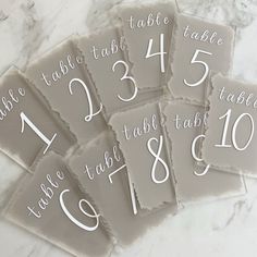 the table numbers are laid out on top of each other, with white ink in them