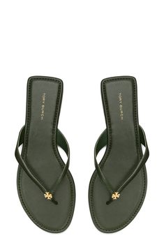 Signature logo hardware details the toe post of a versatile flip flop that will complement your warm-weather style. Flat sole Leather or synthetic upper/leather lining and sole Imported Classy Flip Flops, Classic Flat Flip Flops For The Beach, Classic Toe Post Sandals For Spring, Green Synthetic Flip Flops With Cushioned Footbed, Classic Summer Flip Flops, Classic Open Toe Flip Flops With Textured Footbed, Green Flip Flops With Textured Footbed, Classic Toe Post Flip Flops For Beach, Classic Beach Toe Post Flip Flops