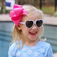 These Heart Toddler Sunglasses are a must for a stylish and fun look! With polarized, UV-protected lenses, these sunglasses showcase a heart shape frame with a charming mini heart print. Elevate their sunny day style with these essential accessories! Toddler size measurements:Frame width: 4.5 in.Temple length: 4.5 in. Heart Shaped Frame, Heart Sunglasses, Mini Heart, Toddler Sizes, Heart Print, Sunny Days, Sunnies, Heart Shapes, Sunglasses