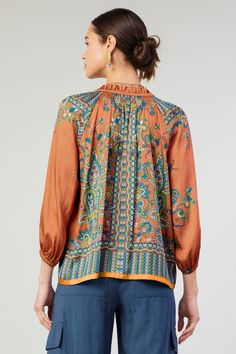 An ornate paisley print with an intricate border decorates this airy long-sleeve blouse. Accented by smocking and ruffles, the split-neck top features a slender self-tie and falls to a loose, easy shape with turquoise tracing the hem. "•Split neckline with self-tie •Ruffle trim •Smocking •Long sleeves •Elasticized cuffs •Relaxed fit Item number 2430488 100% Polyester Gentle cycle cold Line Dry Long Sleeve Peasant Top With Boho Print For Fall, Spring Long Sleeve Tops With Paisley Print, Long Sleeve Boho Print Peasant Top For Fall, Fall Bohemian Split Neck Tops, Long Sleeve Tops With Paisley Print For Spring, Long Sleeve Paisley Print Tops For Spring, Printed Long Sleeve Peasant Top For Fall, Bohemian Viscose Tops With Blouson Sleeves, Patterned Silk Tops For Fall