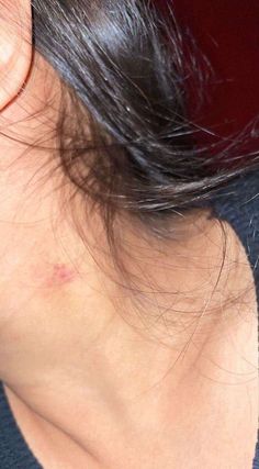 the back of a woman's neck with black hair