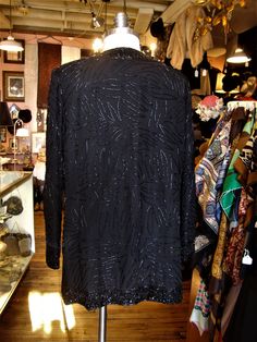 "This is a vintage beaded evening jacket by Brilliante from the 1980's or 90's. It closes down the front with sets of hooks and eyes, is lined and has removable shoulder pads. Great for the holidays! It's in great condition! Comes from a smoke free home. Measurements: Bust: 38\" Waist: 38\" Hip: 40\" Across Shoulder: 15\" Sleeve Length: 23\" Length from Shoulder: 31.5\" Please ask me any questions you may have before buying as this is a final sale. Please know your measurements and allow for mov Sequined Outerwear For Holiday Evenings, Embellished Holiday Outerwear For Evening Events, Holiday Evening Embellished Outerwear, Glamorous Beaded Outerwear For Evenings, Glamorous Beaded Evening Outerwear, Winter Outerwear With Sequins, Vintage Sequin Outerwear For Night Out, Vintage Beaded Evening Outerwear, Beaded Outerwear For Night Out In Fall