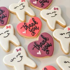 decorated cookies are arranged in the shape of hearts