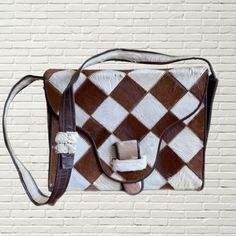 Vintage 60s Pony Hair Purse  White and Brown checkered print w pony hair fabric  structured box bag mirror inside brown leather interior long shoulder strap flaws as pictured. minimal wear to ponyhair, some creases inside Measurements: Height:9 Length:11 Width:3 Vintage Brown Rectangular Shoulder Bag For Office, Rectangular Vintage Brown Shoulder Bag For Office, Retro Vintage Brown Rectangular Shoulder Bag, Vintage Brown Square Box Bag, Retro Brown Rectangular Box Bag, Brown Retro Rectangular Box Bag, Luxury Vintage Brown Rectangular Shoulder Bag, Vintage Brown Rectangular Shoulder Bag With Adjustable Strap, Brown Rectangular Shoulder Bag