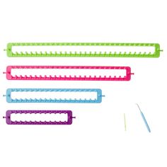 four different colored plastic combs with scissors