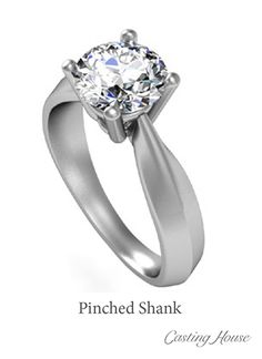 an engagement ring with a single diamond in the center and a curved shank on the side