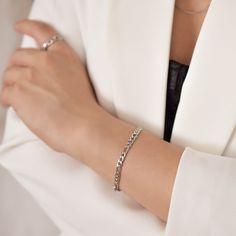 "This bracelet features a figaro chain that measure 5 mm wide and can be made to fit your wrist snugly. Be sure to measure your wrist if you are going for a tight fit like the model who is wearing the 5.75 inches. Otherwise, the standard length at department stores for women's bracelets is 7 inches. Made of surgical steel, which features a deep, true silver color, this piece of jewelry is hypoallergenic, water-resistant, and tarnish-resistant. --------------------♥ PROMOS ♥-------------------- W Silver Cuban Link Bracelet With Adjustable Chain, Trendy Silver Curb Chain Bracelet, Silver Minimalist Cuban Link Bracelet, Silver Minimalist Cuban Link Bracelet With Adjustable Chain, Elegant Silver Cuban Link Bracelet With Adjustable Chain, Minimalist Silver Cuban Link Bracelet With Curb Chain, Elegant Silver Bracelet With Figaro Chain, Silver Cuban Link Bracelet With Figaro Chain As Gift, Silver Figaro Chain Link Bracelet