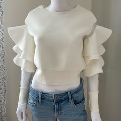 New With Tags. Size S Chic Cream Tops With Ruffle Sleeve, Trendy Stretch Blouse With Ruffles, Trendy Cream Tops With Ruffles, Chic Cream Ruffled Tops, Trendy White Ruffle Sleeve Blouse, Stretch Blouse With Ruffles For Spring, Stretch Blouse With Ruffles For Day Out, Cream Ruffled Top For Party, Fashion Nova Tops