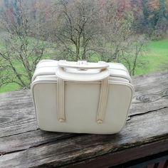 You are looking at very nice vintage woman bag made in 70s. The bag has an accordion style. It is made of beautiful white leather. The bag is in great vintage condition with some marks of daily use, especially in the bottom of the bag (please look the picture). Inside of the bag is in adorable red colour. The bag is very nice looking. It could be very special gift. Dimensions: Height: 22 cm or approx. 9 inch Width:29 cm or 11, 4 inch. Delivery worldwide. If you are interested in more my items, p Vintage White Bags For Travel, Retro White Bags For Everyday Use, Vintage White Shoulder Bag For Everyday Use, White Retro Formal Bags, Vintage White Satchel For Daily Use, Retro Cream Rectangular Shoulder Bag, Retro White Formal Bags, Retro White Formal Bag, Large Capacity White Retro Bag