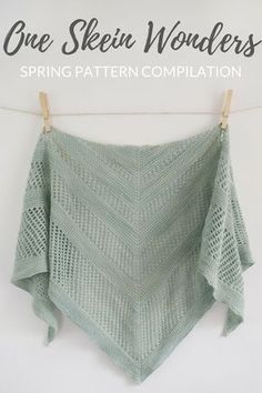 a green shawl hanging on a clothes line with the words, one skein wonders spring