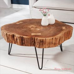 a wooden table with two white vases on it's top and hairpin legs