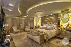 a luxurious bedroom with gold accents and chandeliers on the ceiling is pictured in this image