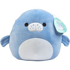 a blue stuffed animal with a tag on it's ear and nose, sitting in front of a white background