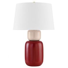 a red table lamp with a white shade