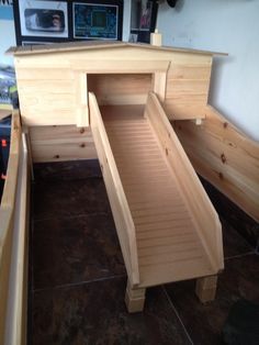 a wooden bench that is open on the floor