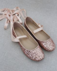 "Comfy and sparkly allover rock glitter ballet flats and with satin ribbon tie strap. Definitely will brighten up everything you wear. Perfect for bride and bridesmaids for comfy wear during wedding or after to change into. YOU CAN CHOOSE ON STYLE IF SHOES: BALLERINA LACE UP OR MARYJANE TIE DETAILS: SATIN LACE WIDTH: BALLERINA LACE UP (7/8 INCH) & MARYJANE TIE (1.5 INCHES) COLORS AVAILABLE: Gold, Silver, White, Rose Gold, Red and Navy UPPER: Synthetic upper and lining MATERIALS: Mandmade out