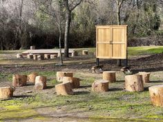 a group of wooden benches and tables in a park