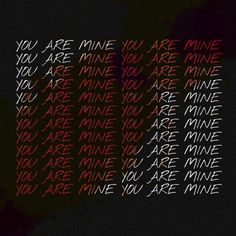 the words you are mine written in red and black on a dark background with white writing