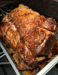 a large piece of meat sitting on top of an oven