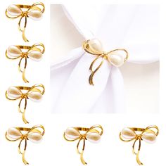 the gold bow tie is tied with pearl beads and sits on a white shirt, along with several other pieces of clothing