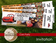 two cars movie tickets sitting on top of green grass