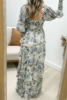 Looking for a dress that's "Swept Away" by style and comfort? Look no further than this maxi featuring a playful tiered design and trendy square neck. The printed pattern adds a touch of whimsy while the smocking at the bust and cuffs ensures a comfortable fit. With semi sheer sleeves and an all around light weight fabric, this dress is simply perfect for any occasion! 100% Polyester Jaclyn is a size 1, wearing a small. Mini Shirt Dress, Sheer Sleeves, A Dress, Square Neck, T Shirt Dress, Long Tops, Short Tops, Smocking, Sweater Top