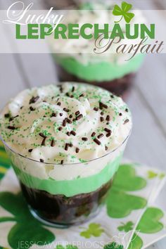 two desserts with green and white frosting in small glass dishes on a table