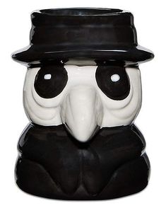 a black and white owl with a hat on its head is wearing a top hat