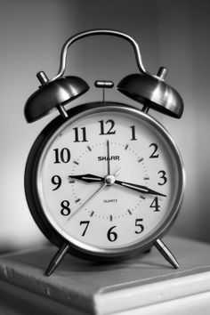 black and white photograph of an alarm clock