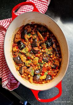 a pot filled with food sitting on top of a table