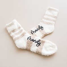 Custom Fuzzy Socks are a thoughtful gift idea for friends and family this holiday season. Get them for your best friends to match at a sleepover or for Christmas morning with the family. Pair them with our comfy sleep shirts, robes, or PJs for a complete gift idea. These fuzzy crew-length socks are personalized with custom names in black vinyl. Choose from our neutral beige or pink striped socks. DETAILS Listing is for 1 Pair of Fuzzy Socks with Custom Name. NO RETURNS OR EXCHANGES ON SOCKS/CLOTHING ITEMS. Style: Fuzzy Crew Socks (text is printed in black vinyl) Size: Fits women shoe sizes 5-10. NO RETURNS OR EXCHANGES ON SOCKS/CLOTHING ITEMS. CARE INSTRUCTIONS:  Wash inside out, gentle cycle, cold water, tumble dry low. More HOLIDAY Gifts https://www.etsy.com/shop/ModParty?ref=shop_sugg&s Sock Gift Ideas, Holiday Socks Gift, Bar Bracelet Personalized, Inexpensive Holiday Gifts, Valentines Socks, Gift Ideas Personalized, Sock Gift, Holiday Socks, Personalized Makeup Bags