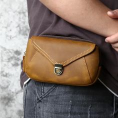 Effortlessly redefine your style with this essential men's waistbag, a versatile piece crafted from genuine leather. This retro-inspired accessory seamlessly combines convenience with a touch of fashion, serving as both a functional and stylish companion. Designed for everyday use, it offers ample space for essentials and features an attractive pattern. Order now and make this multifunctional and retro-chic waist pack a staple in your wardrobe. Specifications Brand Name: GeraldBlack Material Composition: Top layer cowhideMain Material: Genuine LeatherOrigin: Mainland ChinaCN: GuangdongStrap Drop: 1.95inchPattern Type: SolidShape: BoxGender: MENStyle: CasualItem Type: Waist PacksItem Length: 7.41inchPlace Of Origin: China (Mainland)Model Number: Y6002 Shipping This product ships from China Brown Leather Belt Bag With Phone Holder, Brown Leather Belt Bag For Mobile Phone, Brown Leather Belt Bag With Cell Phone Pocket, Brown Leather Mobile Phone Belt Bag, Brown Leather Belt Bag With Mobile Phone Holder, Vintage Brown Leather Belt Bag, Brown Belt Bag With Zipper Pocket For Business, Classic Brown Belt Bag For Mobile Phone, Brown Belt Bag With Cell Phone Pocket For Everyday