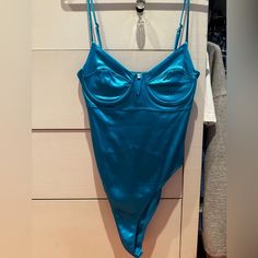 Perfect Condition - Never Worn Price Open To Negotiation Sleeveless Blue Bodysuit For Party, Chic Blue Swimwear For Party, Blue Fitted Bodysuit For Party, Fitted Blue Bodysuit For Party, Chic Blue Fitted Bodysuit, Light Blue Sleeveless Swimwear For Party, Blue Summer Bodysuit For Parties, Blue Bodysuit For Summer Parties, Fitted Blue Bodysuit For Night Out