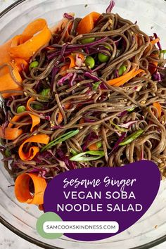 a bowl filled with noodles and veggies on top of a table