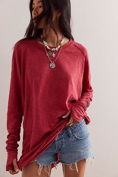 Easy and classic, this lightweight long sleeve tee will be your new go-to. * Slouchy oversized tee * Unfinished trim * Thumb holes on the cuffs * Rounded hem **Note:** Color Code 004 (Heather Grey) Contents- 90% Cotton, 10% Polyester | We The Free Arden Tee at Free People in Brown, Size: XS Stretchy Tops, Waffle Knit Top, High Neck Long Sleeve, Layered Tops, Free People Tops, Black Stretch, Red Fashion, Vintage Tops, Fashion Tops