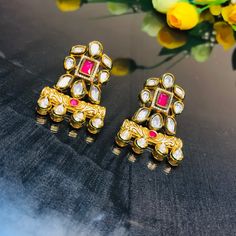 These are a beautiful pair of Earrings, made with beautifully Kundan beaded. These earrings work well with all types of clothing, whether it be formal attire or a casual party. Option 1 : Red Color (E716) Option 2 : Green Color (E717) Eye-catching and unique jewellery that will set you apart. Gift this piece to a loved one, and see their face light up with joy. Best for gifting or for personal use, wear it to any occasion and be in the spotlight. Types Of Clothing, Kids Handicraft, Saree Jewellery, Silver Pooja Items, Glass Bangles, Silver Toe Rings, Gold Chain With Pendant, Ruby Beads, Kundan Earrings