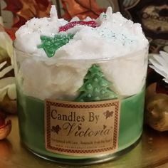 a glass jar filled with green and white candy